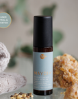 Maydi brightening daily serum bottle with natural elements in the background