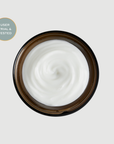 Jar of Maydi+ hydrating treatment mask white cream with a brown lid on a light grey background