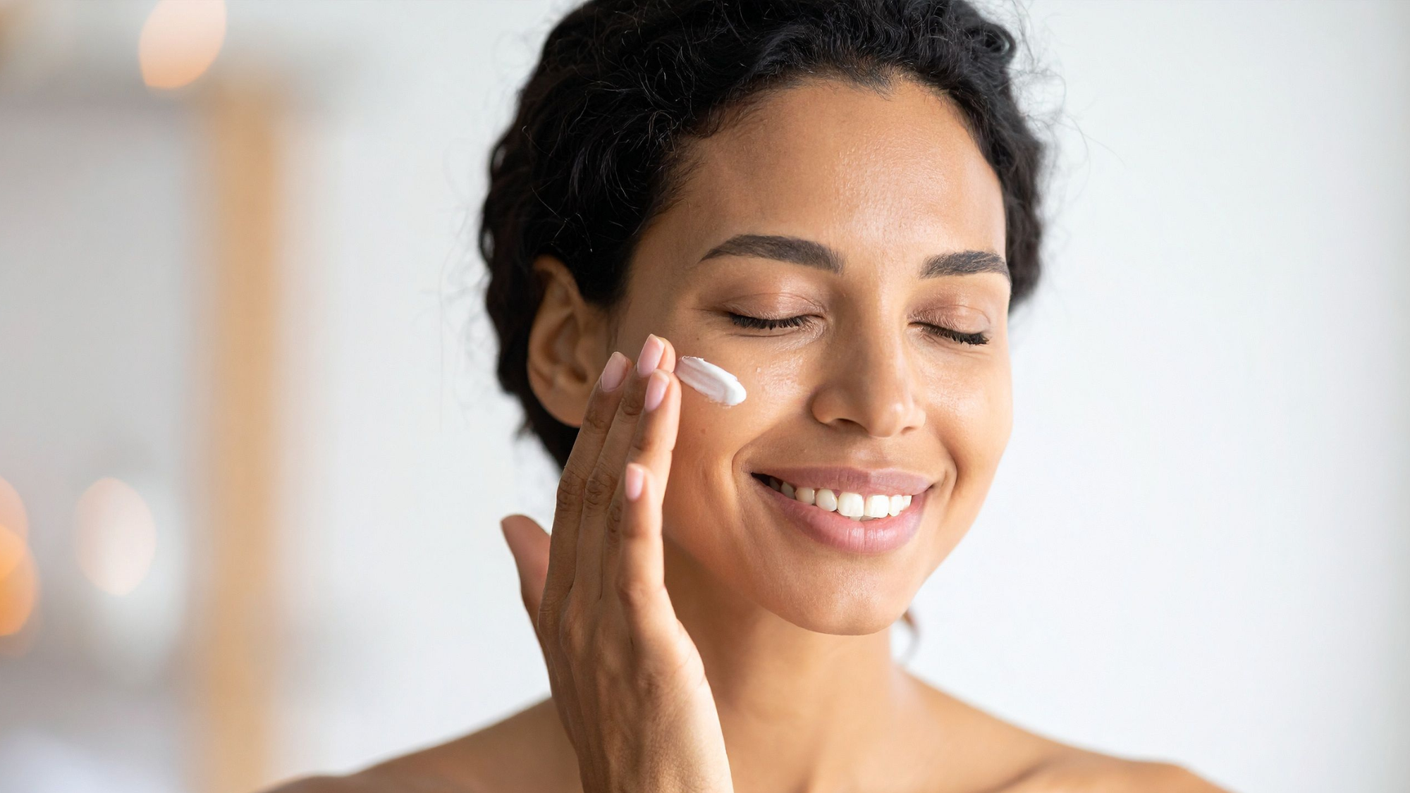 Black women with midlife skin applying skincare